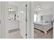 View through a doorway to a bathroom and bedroom with clean, modern designs at 3026 Prospect Trl, St Cloud, FL 34771