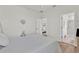 Comfortable bedroom with ample natural light, neutral colors, and a view of the bathroom at 3026 Prospect Trl, St Cloud, FL 34771