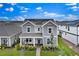Inviting two-story home showcasing a manicured front yard and a cozy front porch at 3026 Prospect Trl, St Cloud, FL 34771