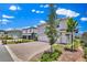 Well-maintained home featuring a brick driveway, two-car garage, and fresh landscaping at 3026 Prospect Trl, St Cloud, FL 34771