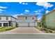 Charming two-story home with a brick driveway, two-car garage, and manicured landscaping at 3026 Prospect Trl, St Cloud, FL 34771