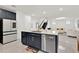 Open-concept kitchen featuring a large island with a sink and stainless steel dishwasher at 3026 Prospect Trl, St Cloud, FL 34771