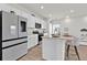 Bright kitchen featuring white cabinets, stainless steel appliances, and an island with bar seating at 3026 Prospect Trl, St Cloud, FL 34771