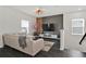 Bright living room featuring a comfortable sofa, modern decor, and natural light at 3026 Prospect Trl, St Cloud, FL 34771