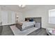 Inviting main bedroom with a large bed, soft rug, and modern lighting at 3026 Prospect Trl, St Cloud, FL 34771