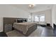 Spacious main bedroom featuring a king bed, large windows, and cozy sitting area at 3026 Prospect Trl, St Cloud, FL 34771