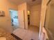 Neutral bathroom features tiled floor, access to toilet, shower and Primary bedroom at 306 Briar Patch Loop, Davenport, FL 33896