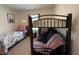 Cozy bedroom featuring a bunk bed, a twin bed, and natural light, creating a functional and comfortable living space at 306 Briar Patch Loop, Davenport, FL 33896