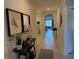 Inviting tiled hallway with decorative accents and arched entryways to living spaces at 306 Briar Patch Loop, Davenport, FL 33896