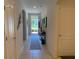 Inviting tiled hallway with decorative accents and arched entryways to living spaces at 306 Briar Patch Loop, Davenport, FL 33896