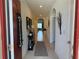 Inviting tiled hallway with decorative accents and arched entryways to living spaces at 306 Briar Patch Loop, Davenport, FL 33896