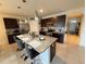 Beautiful kitchen with granite countertops, stainless steel appliances, and stylish island seating at 306 Briar Patch Loop, Davenport, FL 33896