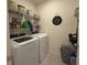 Laundry room with shelving, washer, and dryer at 306 Briar Patch Loop, Davenport, FL 33896