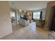 Bright living room with textured wall, tile floor and neutral furniture at 306 Briar Patch Loop, Davenport, FL 33896