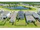 Overhead view capturing this neighborhood next to a pond with mature trees and green space at 3204 Oxbow Ct, St Cloud, FL 34773