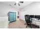 Bedroom featuring a ceiling fan, closet, and desk with dual monitors at 3204 Oxbow Ct, St Cloud, FL 34773