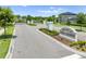 Gated community entrance features manicured landscaping and elegant signage for 'Enclave at Lakes of Harmony' at 3204 Oxbow Ct, St Cloud, FL 34773