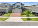 Charming two-story home with brick driveway and well-manicured front lawn creates great curb appeal at 3204 Oxbow Ct, St Cloud, FL 34773