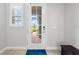 Bright front door with glass panes, sidelight window, and brick entryway creates instant curb appeal at 3204 Oxbow Ct, St Cloud, FL 34773