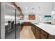 Modern kitchen featuring stainless steel appliances, white countertops, and an open design at 3204 Oxbow Ct, St Cloud, FL 34773