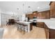 Open-concept kitchen with island seating, connecting to the dining and living spaces for easy entertaining at 3204 Oxbow Ct, St Cloud, FL 34773