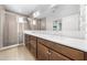 Bathroom with double vanity, walk-in shower, neutral paint, and lots of natural light at 3204 Oxbow Ct, St Cloud, FL 34773