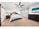 Bright main bedroom with a ceiling fan, ensuite bathroom, carpet, and lots of natural light at 3204 Oxbow Ct, St Cloud, FL 34773