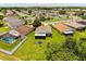 Aerial view of the home showcasing the backyard, screened porch, and neighborhood at 3217 Whooping Crane Run, Kissimmee, FL 34741