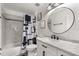 This bathroom features stylish fixtures, a modern vanity, sleek hardware, and a shower-tub combination at 3217 Whooping Crane Run, Kissimmee, FL 34741