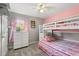 This bedroom features a bunk bed, carpeted floors, and neutral colored walls at 3217 Whooping Crane Run, Kissimmee, FL 34741