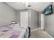 This bedroom boasts neutral colored walls, carpeted floors, and a ceiling fan at 3217 Whooping Crane Run, Kissimmee, FL 34741