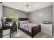 This bedroom boasts neutral colored walls, carpeted floors, and a ceiling fan at 3217 Whooping Crane Run, Kissimmee, FL 34741