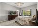 This main bedroom provides a spacious retreat with a large window, carpeted floors, and neutral colored walls at 3217 Whooping Crane Run, Kissimmee, FL 34741