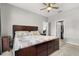 This is a lovely bedroom featuring a ceiling fan, neutral colored walls, a walk-in closet, and carpeted floors at 3217 Whooping Crane Run, Kissimmee, FL 34741