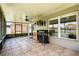 This screened patio is the ideal outdoor space with ceiling fan and tile flooring at 3217 Whooping Crane Run, Kissimmee, FL 34741