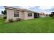 Backyard featuring a lawn at 406 Cinnamon Dr, Kissimmee, FL 34759