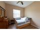 Bedroom with a ceiling fan and a twin bed at 406 Cinnamon Dr, Kissimmee, FL 34759