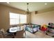 Cozy dining area with a round table and seating, perfect for Gathering meals and playtime at 406 Cinnamon Dr, Kissimmee, FL 34759