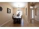 Dining room with a chandelier and a dining table set with six chairs at 406 Cinnamon Dr, Kissimmee, FL 34759