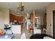 Spacious kitchen and dining area combination with tiled floors, wood cabinetry, and plenty of room to entertain at 406 Cinnamon Dr, Kissimmee, FL 34759
