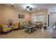 Comfortable living room with tile flooring, ceiling fan, and neutral color palette, perfect for relaxing at 406 Cinnamon Dr, Kissimmee, FL 34759