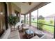 Covered patio with cushioned seating, a ceiling fan, and views of the backyard at 406 Cinnamon Dr, Kissimmee, FL 34759