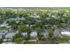 This vibrant neighborhood showcases lush trees, with a glimpse of sparkling blue pools, offering a tranquil escape at 441 Kentia Rd, Casselberry, FL 32707