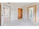 Empty bedroom with closet space and a door leading to an enclosed porch at 441 Kentia Rd, Casselberry, FL 32707