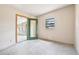 An empty bedroom with a view into the enclosed porch at 441 Kentia Rd, Casselberry, FL 32707
