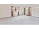 Bright living room featuring neutral carpet and large windows providing ample natural light at 441 Kentia Rd, Casselberry, FL 32707