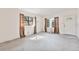 An empty living room featuring large windows and a front door at 441 Kentia Rd, Casselberry, FL 32707