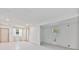 Bright living room with tile flooring, windows, and doorway leading to an adjacent space at 441 Kentia Rd, Casselberry, FL 32707