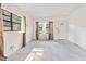 Bright living room featuring neutral carpet and large windows providing ample natural light at 441 Kentia Rd, Casselberry, FL 32707