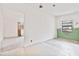 A room showing a window with green lower wall paint, and unfinished upper wall paint with tile floors at 441 Kentia Rd, Casselberry, FL 32707